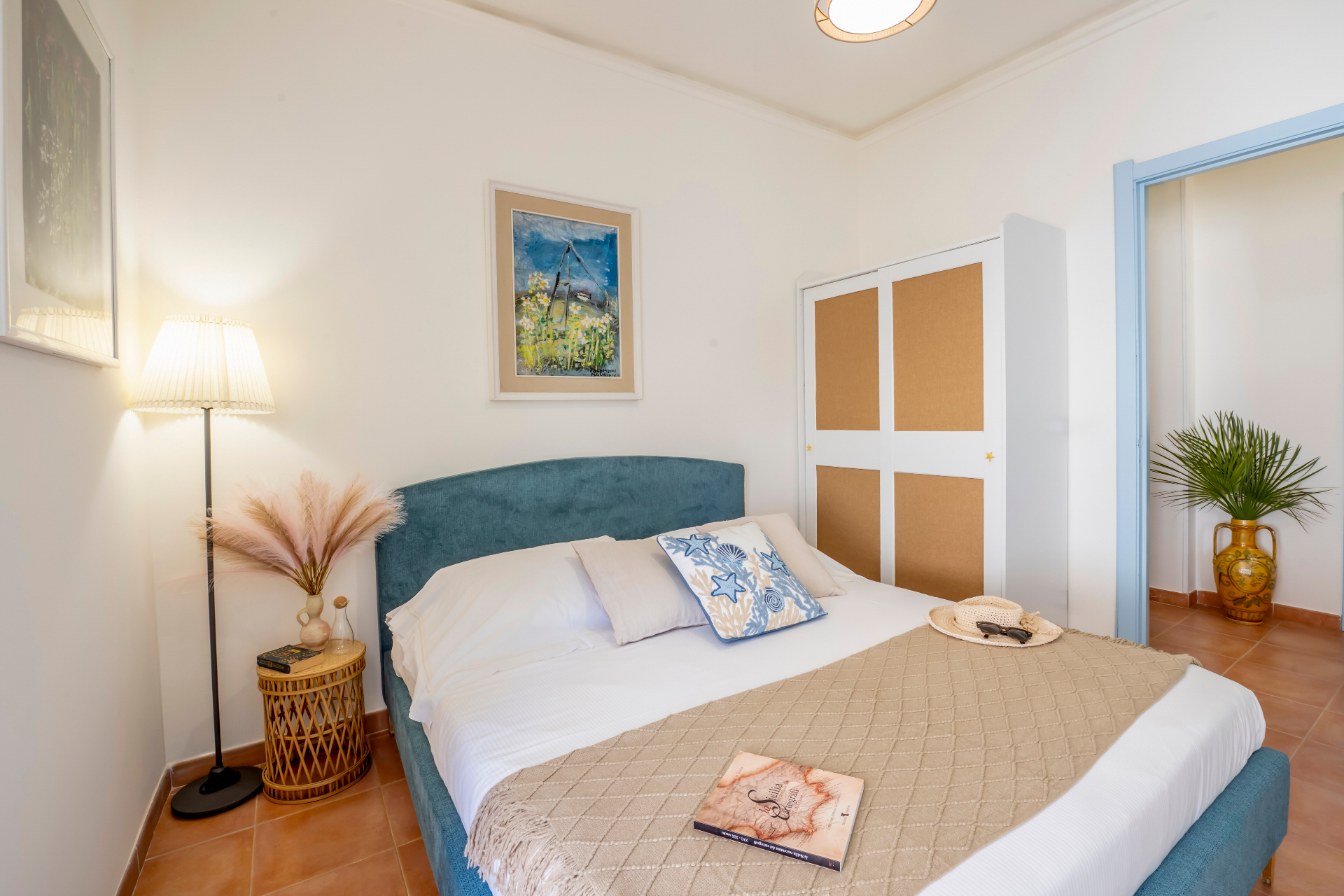 Elegant bedroom with natural light and Mediterranean interiors